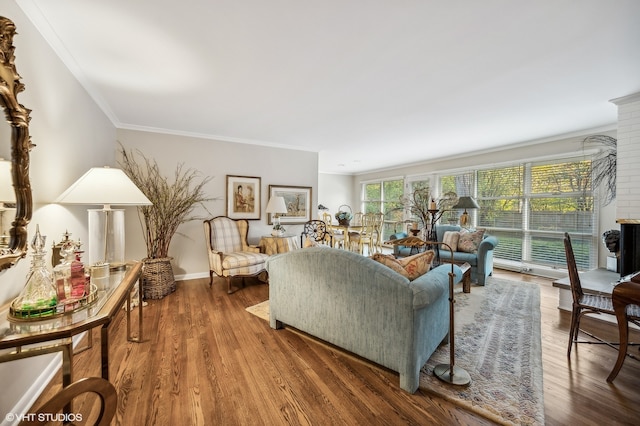 living room with ornamental molding and hardwood / wood-style flooring