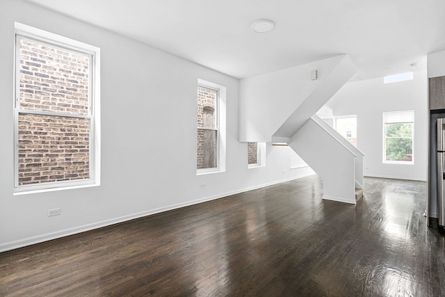 bonus room with dark hardwood / wood-style flooring