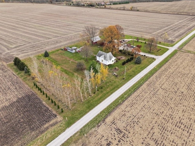 birds eye view of property with a rural view