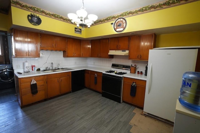 kitchen with tasteful backsplash, white appliances, sink, a chandelier, and washer / clothes dryer