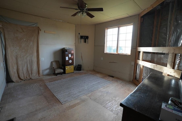 interior space with ceiling fan