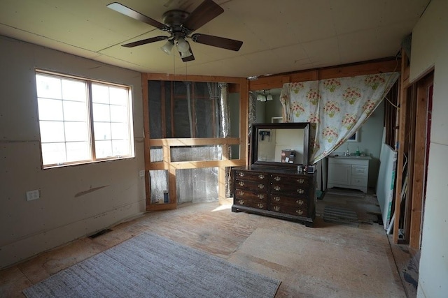 interior space featuring ceiling fan