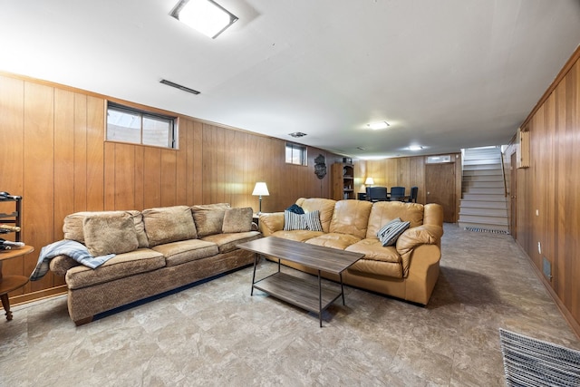 living room with wood walls