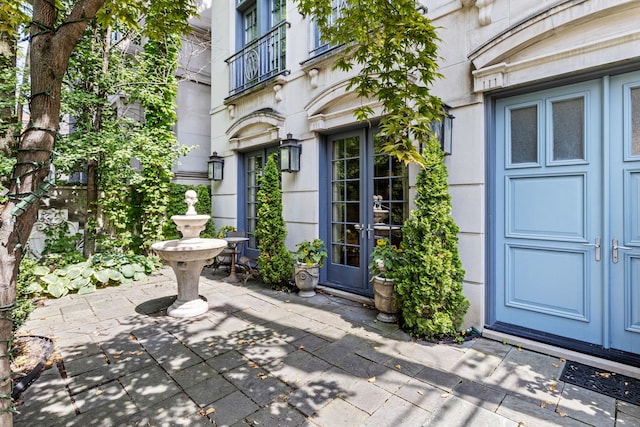 property entrance with french doors and a patio area