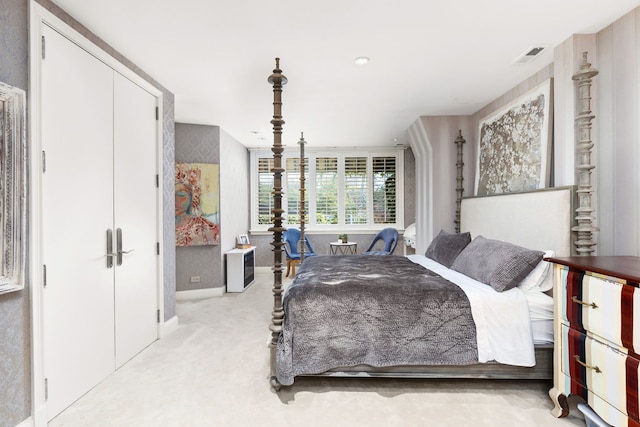 carpeted bedroom with a closet