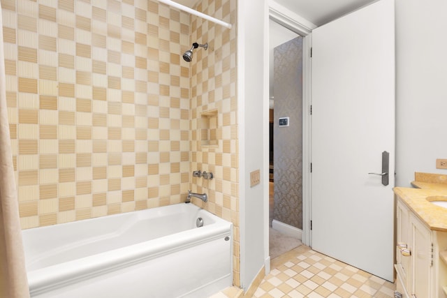 bathroom with vanity, tile patterned floors, and tiled shower / bath