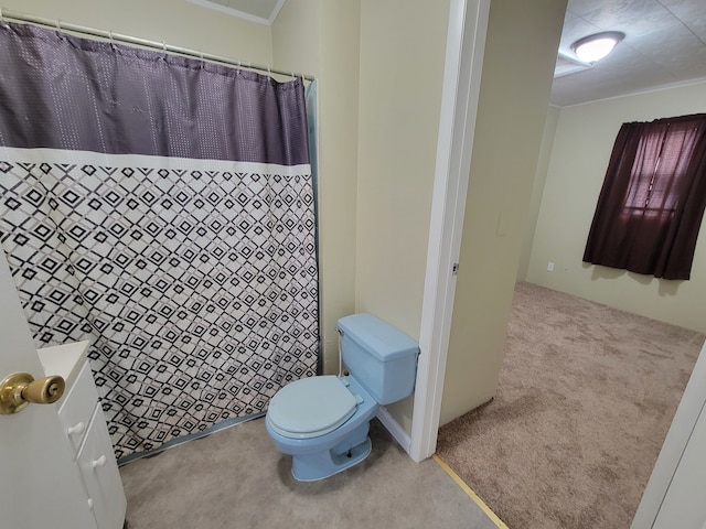 bathroom featuring ornamental molding and toilet