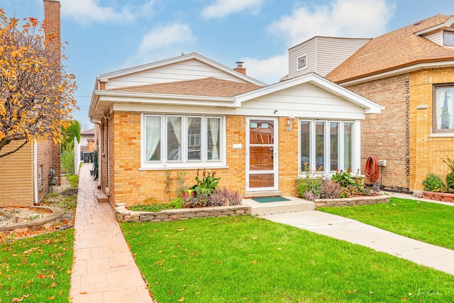 view of front of house with a front lawn