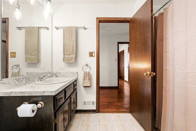 bathroom featuring vanity and hardwood / wood-style flooring