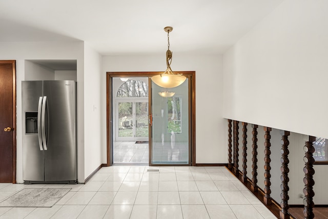 tiled entrance foyer featuring radiator