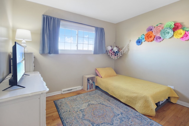 bedroom with hardwood / wood-style flooring