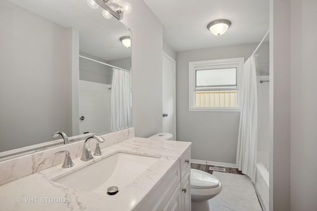 full bathroom with hardwood / wood-style flooring, vanity, toilet, and shower / tub combo