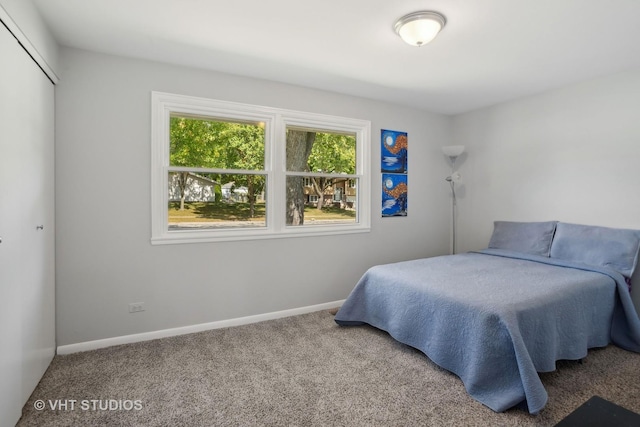 carpeted bedroom with a closet