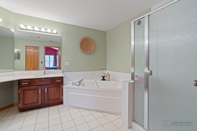 full bathroom with tile patterned floors, a shower stall, vanity, and a bath