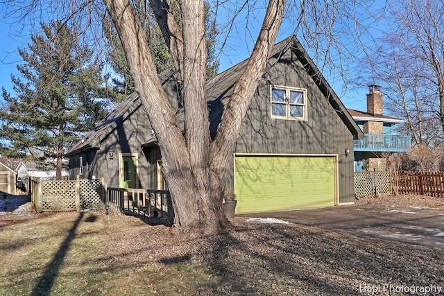 view of property exterior with a garage