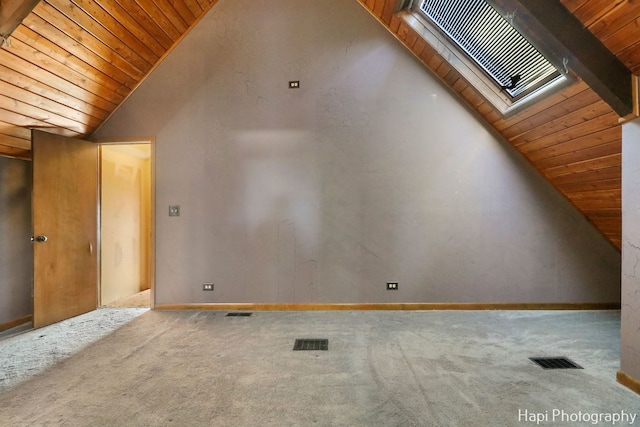 bonus room featuring light colored carpet, lofted ceiling with skylight, and wooden ceiling