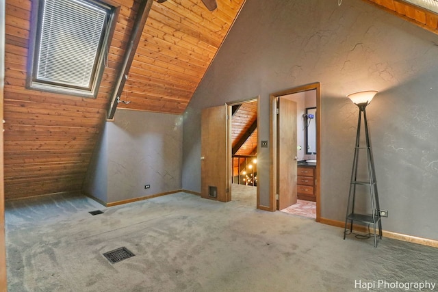 bonus room featuring wooden ceiling, lofted ceiling, and carpet floors