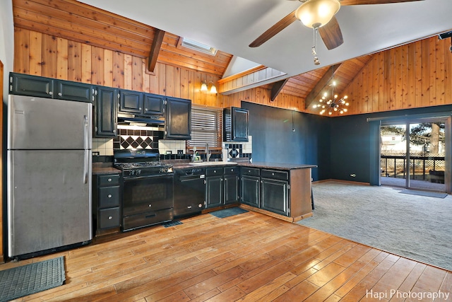 kitchen featuring light hardwood / wood-style floors, black appliances, a skylight, ceiling fan, and sink