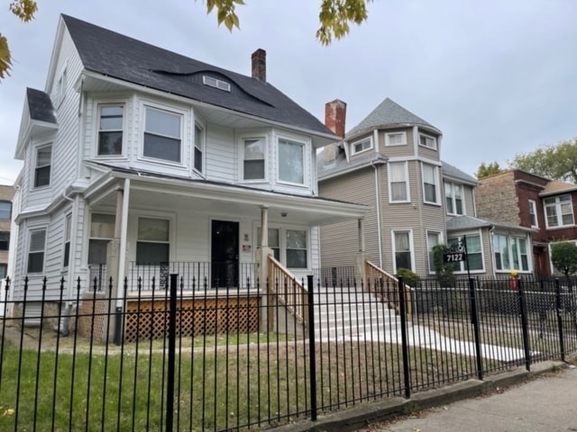 victorian house featuring a porch