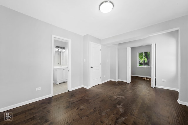 empty room with hardwood / wood-style flooring