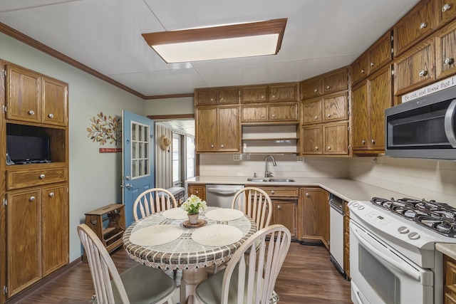 kitchen featuring stainless steel appliances, sink, tasteful backsplash, dark hardwood / wood-style floors, and crown molding