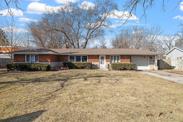 single story home with a garage and a front lawn