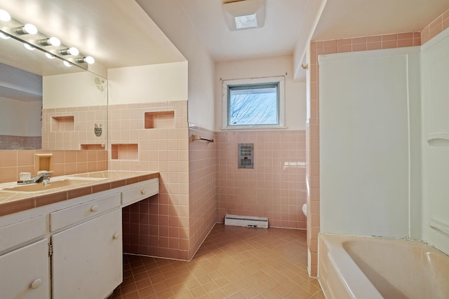 full bathroom with tile patterned floors, toilet, tile walls, shower / bathtub combination, and vanity