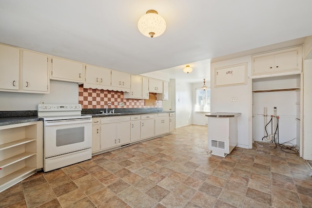 kitchen with tasteful backsplash, sink, white electric range oven, and cream cabinets