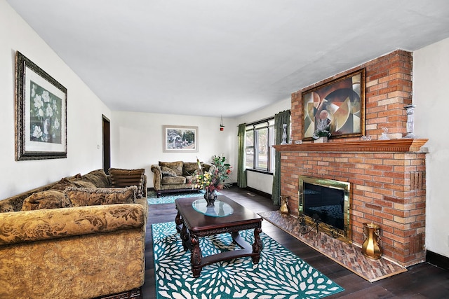 living room featuring dark hardwood / wood-style floors and a fireplace