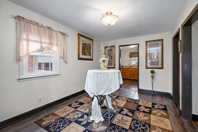 dining space with dark wood-type flooring