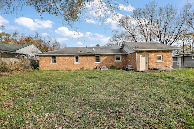 back of house featuring a yard