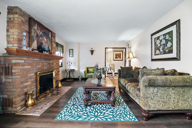 living room with dark hardwood / wood-style floors and a brick fireplace