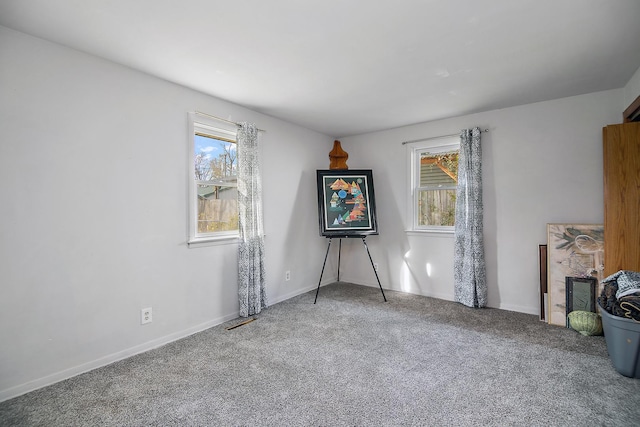 unfurnished room with carpet floors