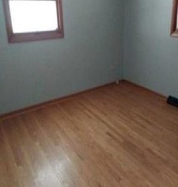 empty room featuring hardwood / wood-style flooring