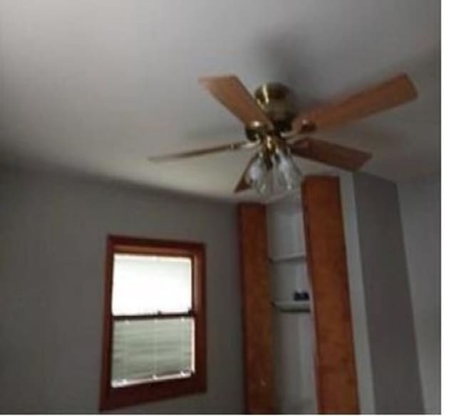 interior details featuring ceiling fan