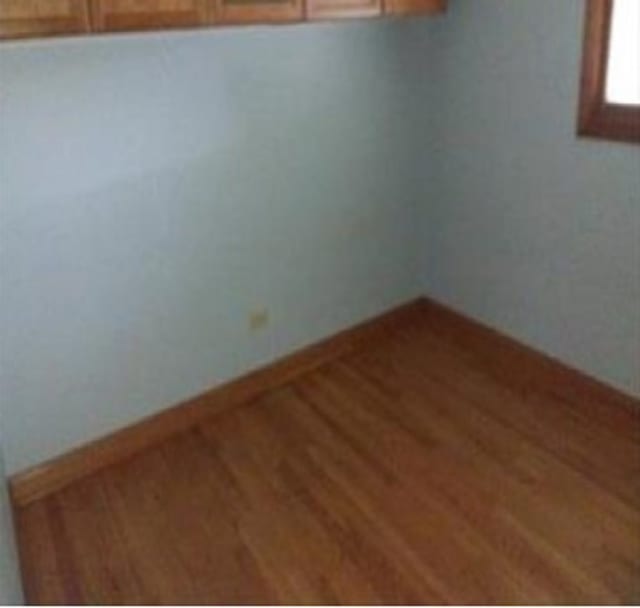 unfurnished room featuring hardwood / wood-style floors