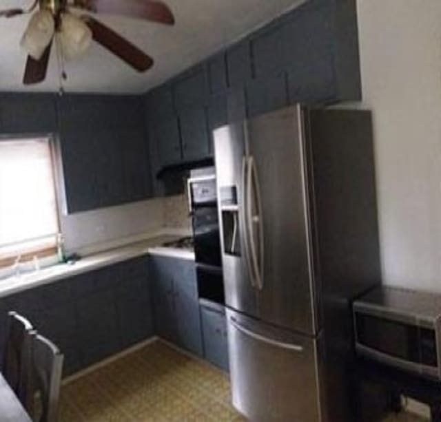 kitchen featuring appliances with stainless steel finishes and ceiling fan