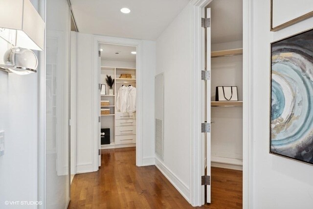 hallway with hardwood / wood-style floors