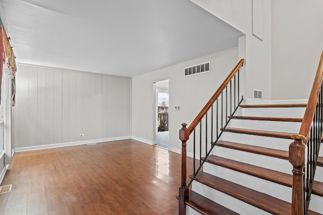 stairs with hardwood / wood-style floors