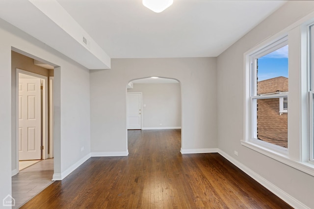 empty room featuring dark wood-type flooring