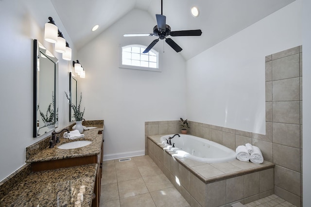 bathroom with vanity, visible vents, vaulted ceiling, tile patterned floors, and a jetted tub