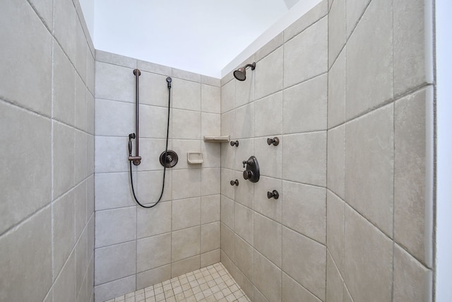 bathroom with a tile shower