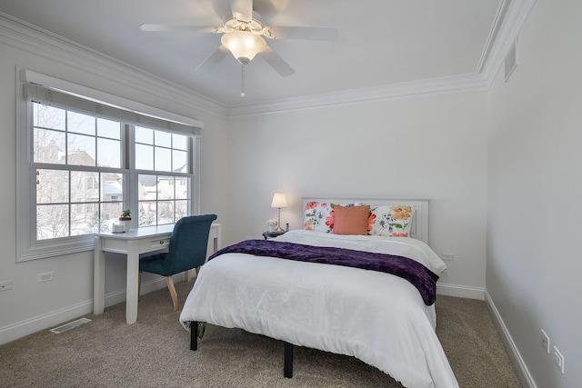 bedroom featuring visible vents, baseboards, carpet flooring, and crown molding