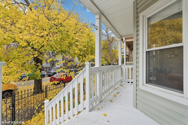 wooden terrace with a porch