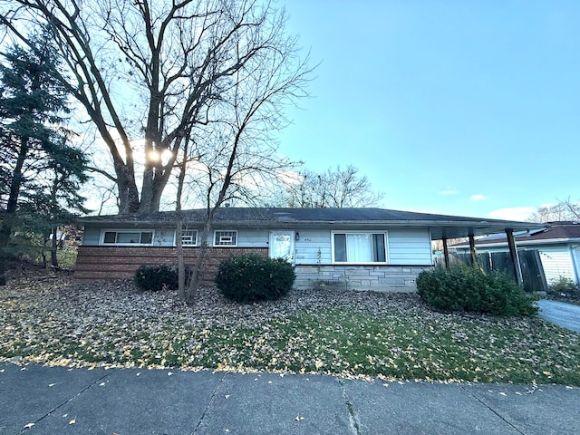 view of front of property featuring a carport