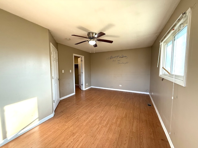 unfurnished room with ceiling fan and light hardwood / wood-style floors