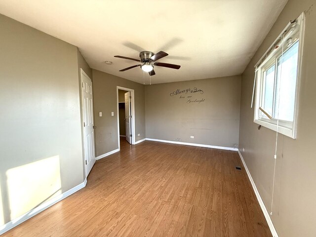 450 Shabbona Dr, Park Forest, IL 60466 - spare room featuring wood finished floors and ceiling fan