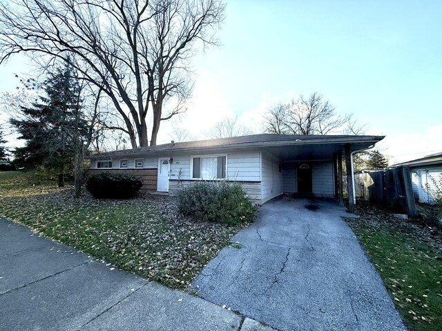 450 Shabbona Dr, Park Forest, IL 60466 - single story home with concrete driveway and an attached carport