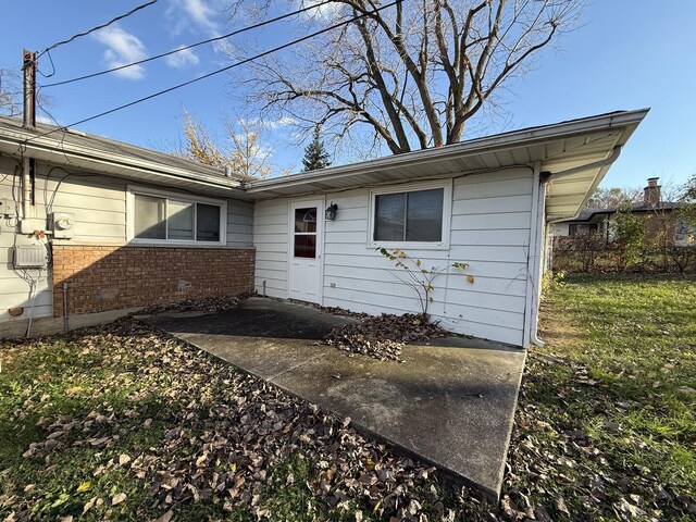 450 Shabbona Dr, Park Forest, IL 60466 - rear view of property featuring brick siding and a patio area
