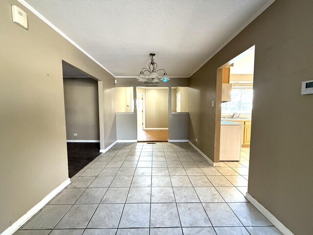 450 Shabbona Dr, Park Forest, IL 60466 - unfurnished dining area featuring ornamental molding, a chandelier, light tile patterned floors, and a textured ceiling